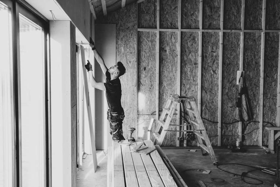 Professional contractor discussing window treatment options